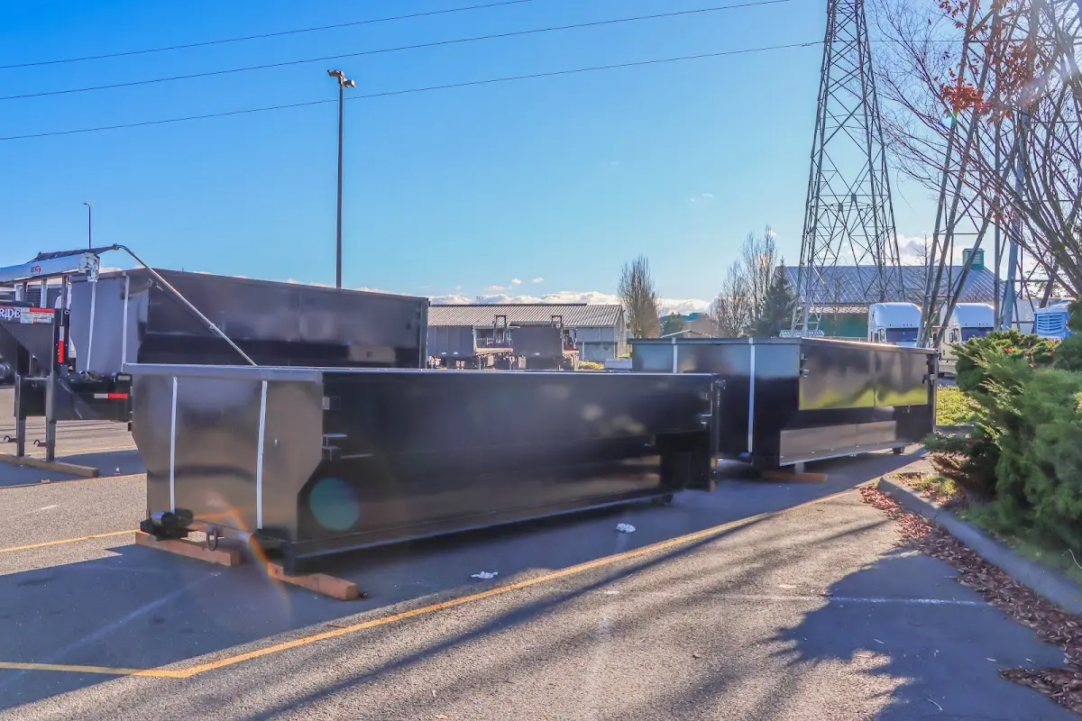 Roll-off dumpster ready for waste disposal at job site for 3 Yard Dumpster Rental in Bella Vista